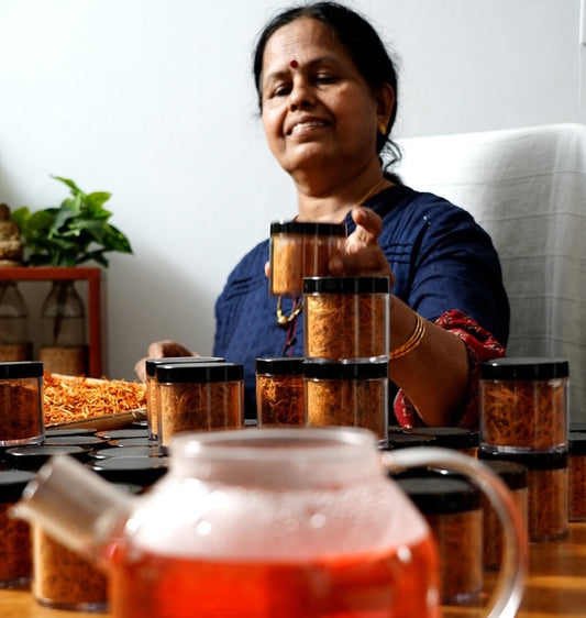 Radha Ma'am holding Pathimughadi Kerala Pink Water