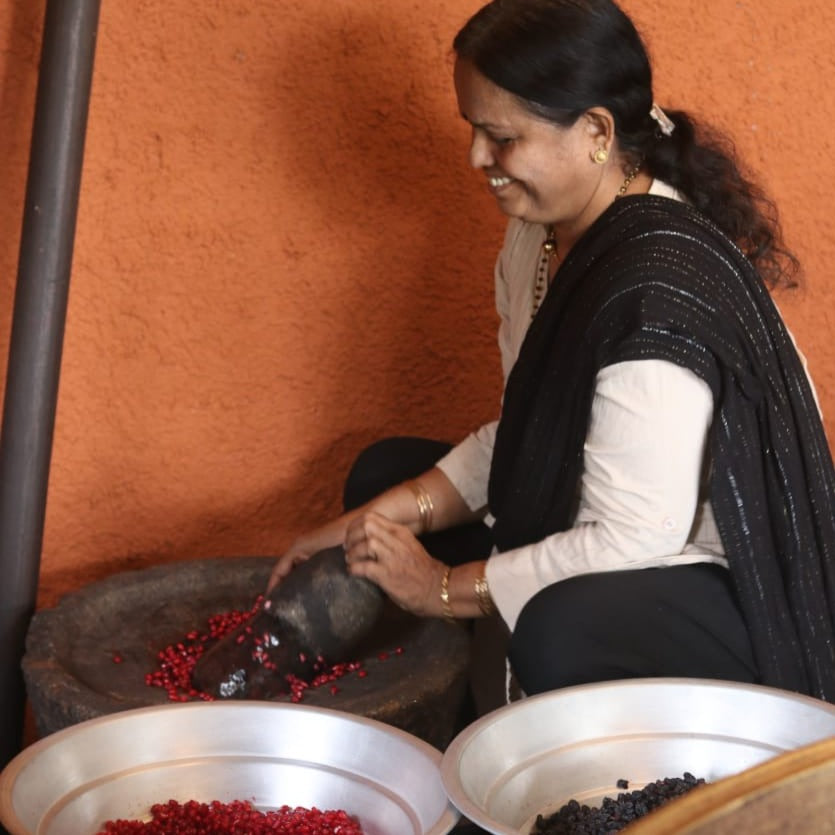 Radha Ma'am preparing Suvarna Glow Oil